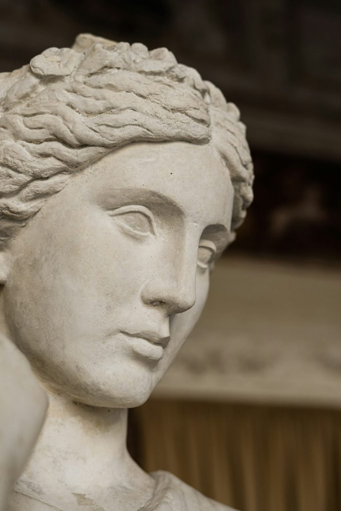 Head of a marble statue of a serene woman lost in thought, Rome, Italy